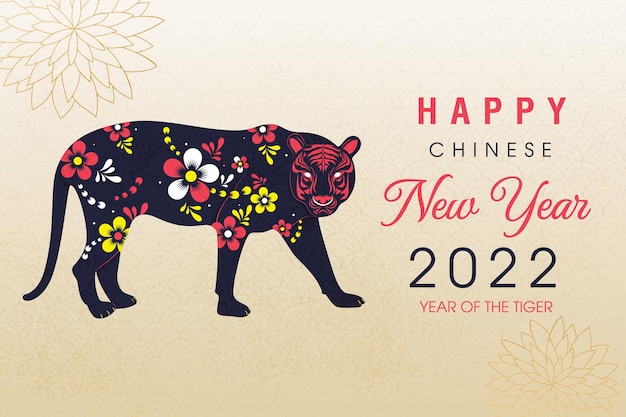 Happy new year 2022 of the tiger written in Chinese character paper art style with elegant flowers