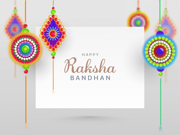 Happy Raksha Bandhan Concept with Beautiful Rakhis Hang on White Background.