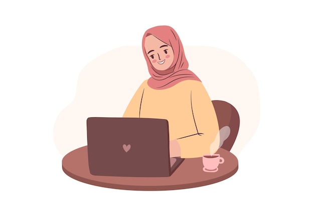 Happy student in hijab working on laptop Empowered business woman or freelancer