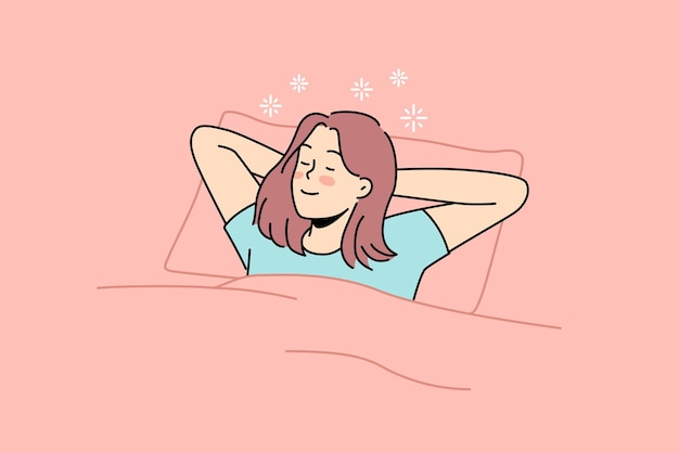 Happy woman lying in bed sleeping