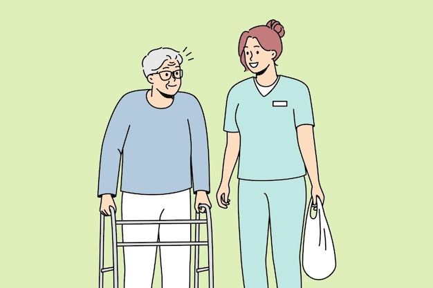 Health care worker helps elderly disabled person with walking frame