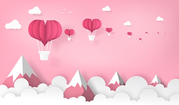 Heart shape balloons flying on the mountain and sky.