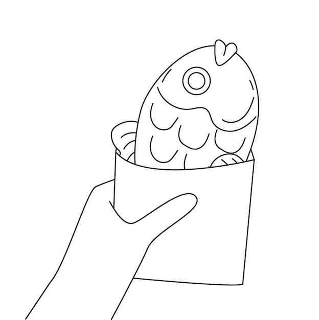 Human hands holding Taiyaki fish Japanese street food dessert in a paper bag