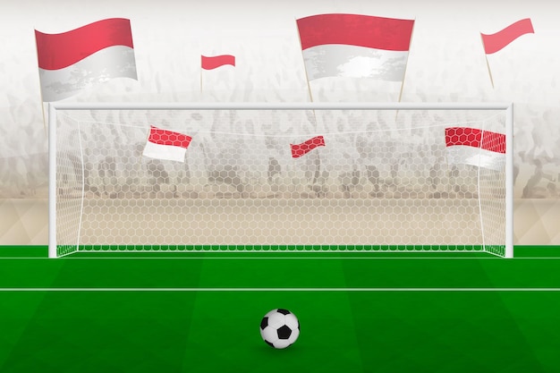 Indonesia football team fans with flags of Indonesia cheering on stadium penalty kick concept in a soccer match