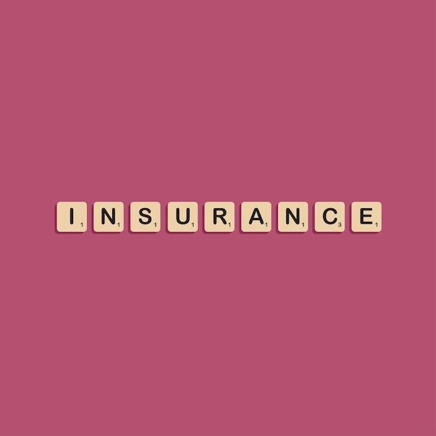 Insurance typographic lettering in scrabbles block alphabet concept