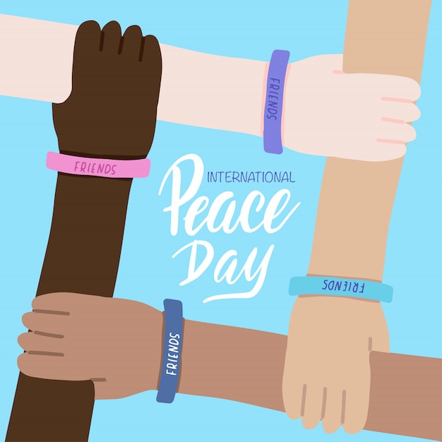 International Peace day greeting card. Four hands of people of different races and crossed together. World friendship.