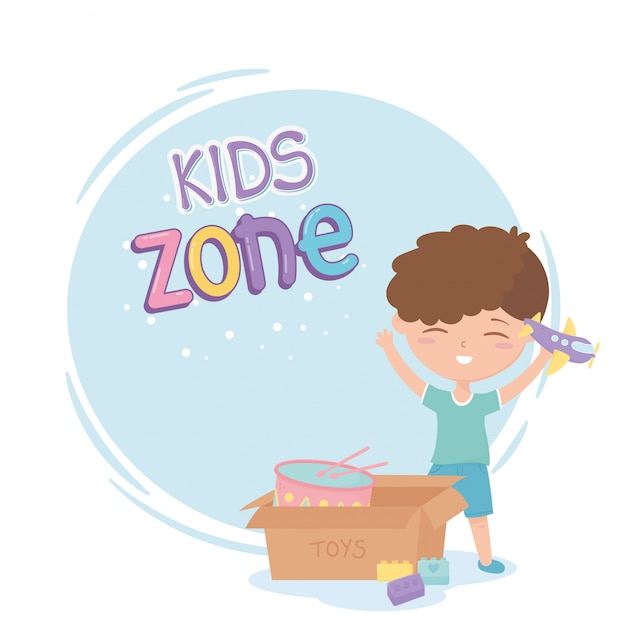 Kids zone, cute little boy with plane and box with drum toys