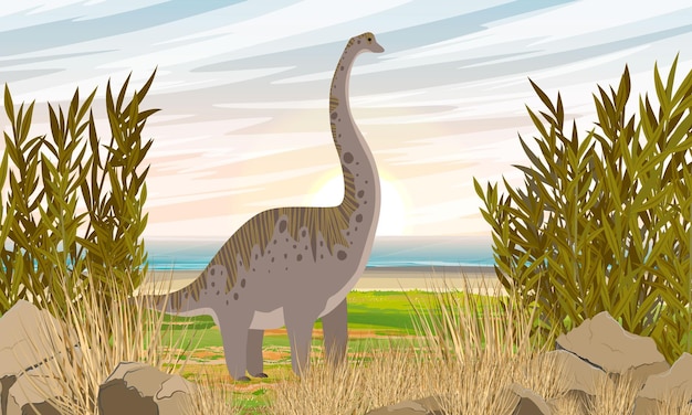 A large brachiosaurus dinosaur stands in the grass on the seashore