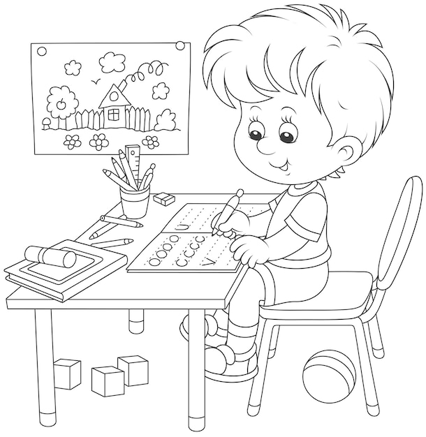 Little boy doing his homework in an exercise book with samples of writing