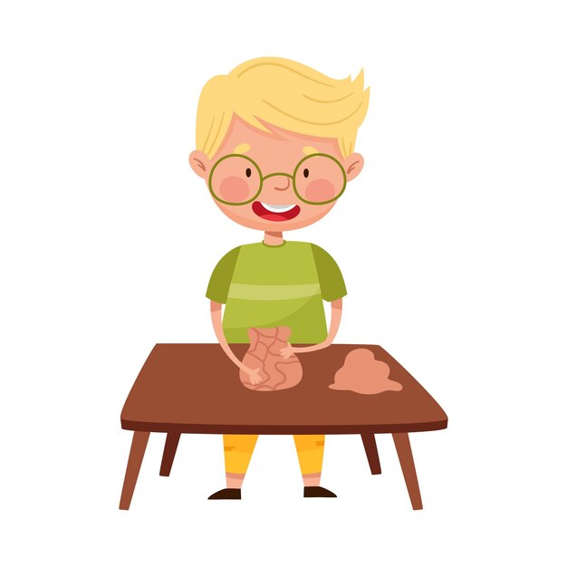 Vector little boy in glasses standing at table and moulding clay vector illustration