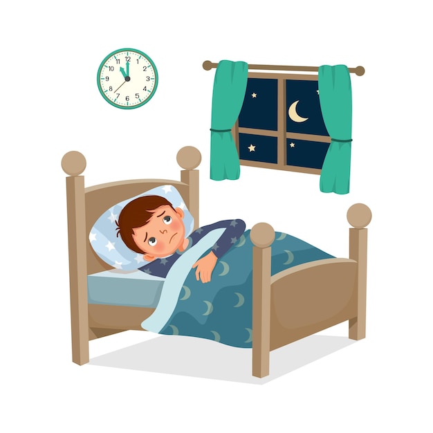 Little boy has insomnia or sleeping disorder stay awake and cannot sleep on bed at night in bedroom