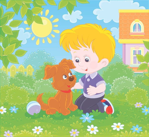 Little boy playing with a small brown pup among flowers on green grass of a lawn in front of a house