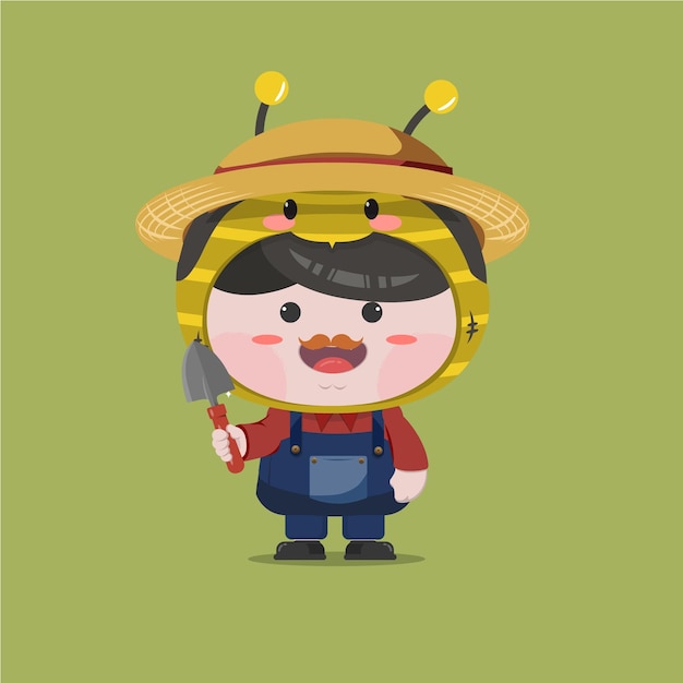 A little boy wearing farmer bee costume