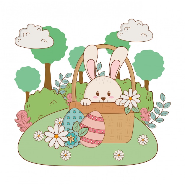 Little rabbit with egg painted in basket on the garden