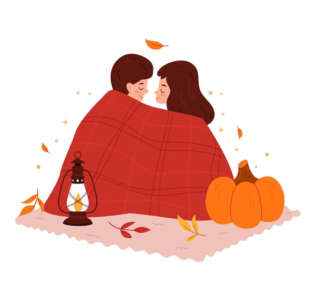 Loving couple on an autumn picnic Lovers in a blanket Romantic setting Kerosene lamp and pumpkin