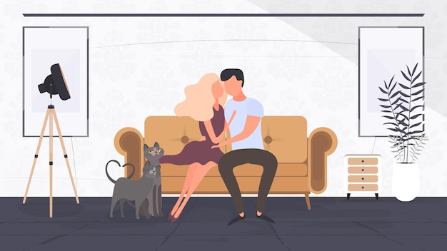 Vector loving couple sitting on the sofa in the room. lovers hug each other. suitable for the design of cards, banners and posters on the theme of love and valentine's day. vector.