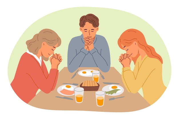 Lunchtime prayer from catholic family thanking god for presence of food on table