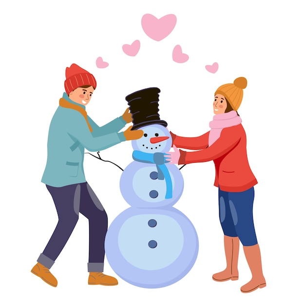 making snowman together. Young man and woman having fun making snowman. Cute of Xmas couple