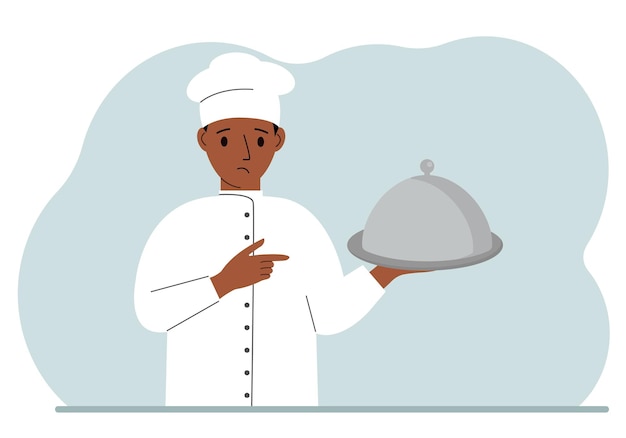 A male chef with a plate covered with a cloche or a tray with a lid