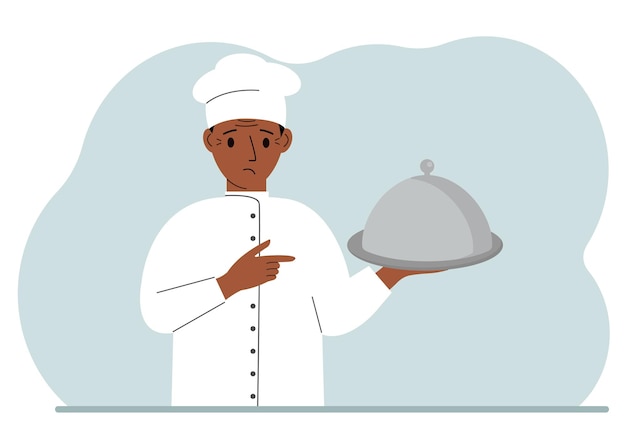 A male chef with a plate covered with a cloche or a tray with a lid