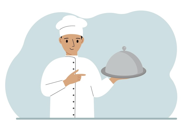 A male chef with a plate covered with a cloche or a tray with a lid