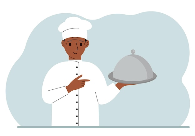 A male chef with a plate covered with a cloche or a tray with a lid