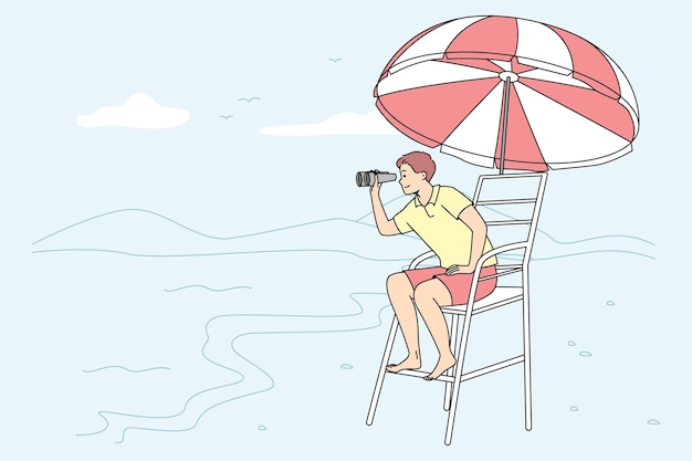 Male lifeguard on tower on beach