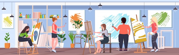 man artists using aerosol spray women with paintbrush drawing pictures painters working together creative occupation concept modern art studio interior horizontal banner