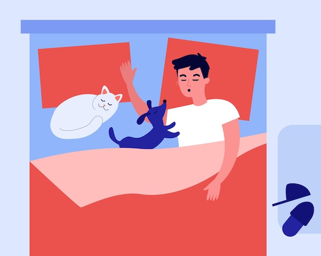 Man and his pets sleeping in bed