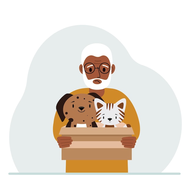 A man holds a cardboard box with a cat and a dog The concept of rescue help and care for pets