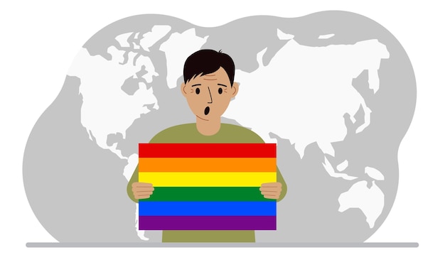 A man holds an lgbt flag in his hands against the backdrop of a world map