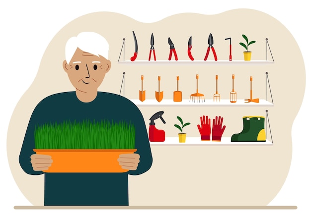 A man holds a plant in his hands against the background of gardening tools Gardening concept