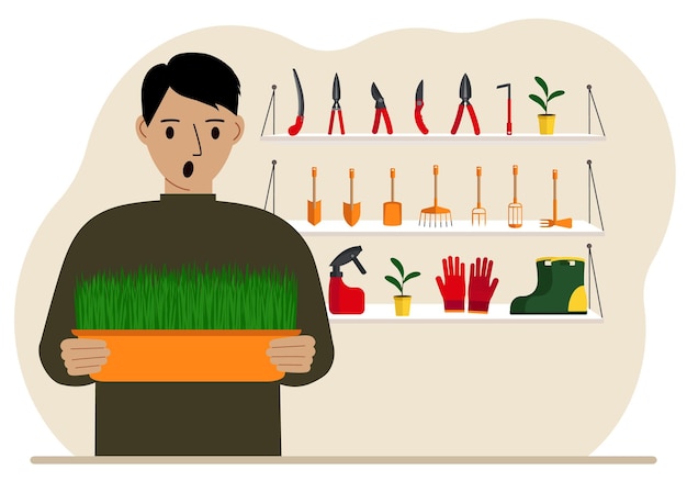 A man holds a plant in his hands against the background of gardening tools Gardening concept