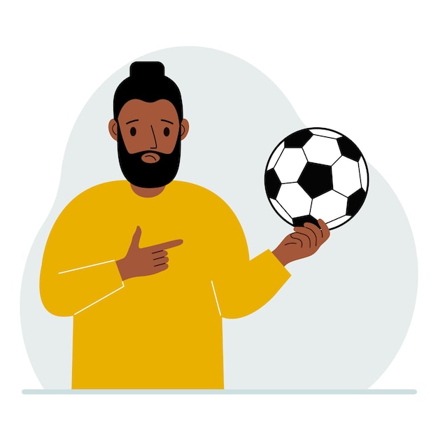 A man holds a soccer ball in his hand The concept of a player fan or coach