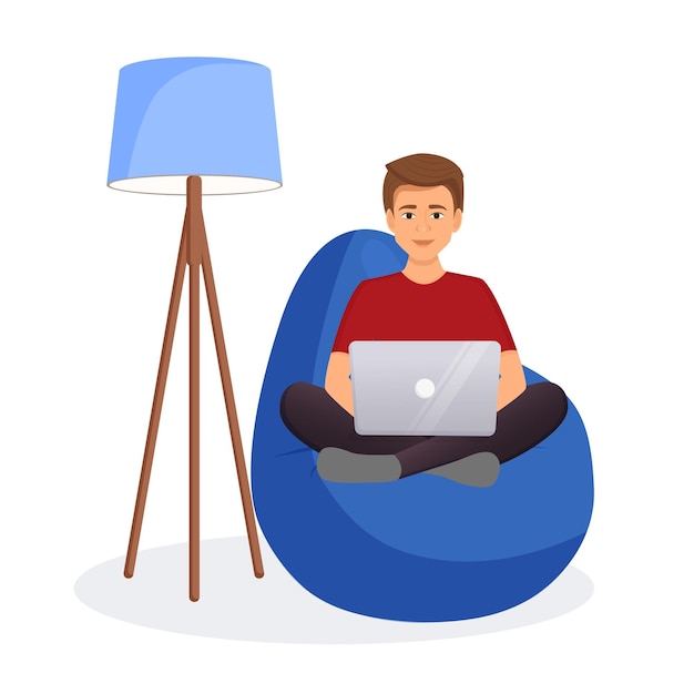 Man sits on a bean bag chair and works at a computer Remote work office at home