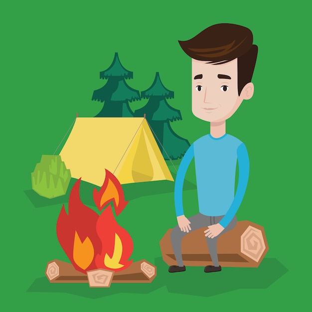 Man sitting on log near campfire in the camping.