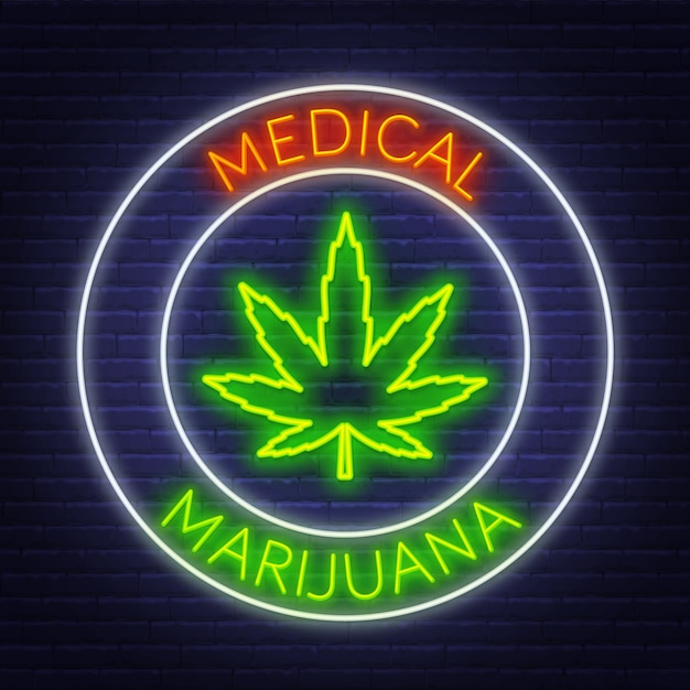 Vector medical marijuana neon sign on the brick wall background.