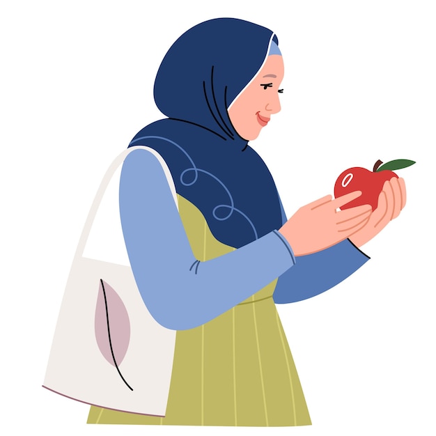 A modern Muslim woman in a hijab and with an eco bag buys fruits