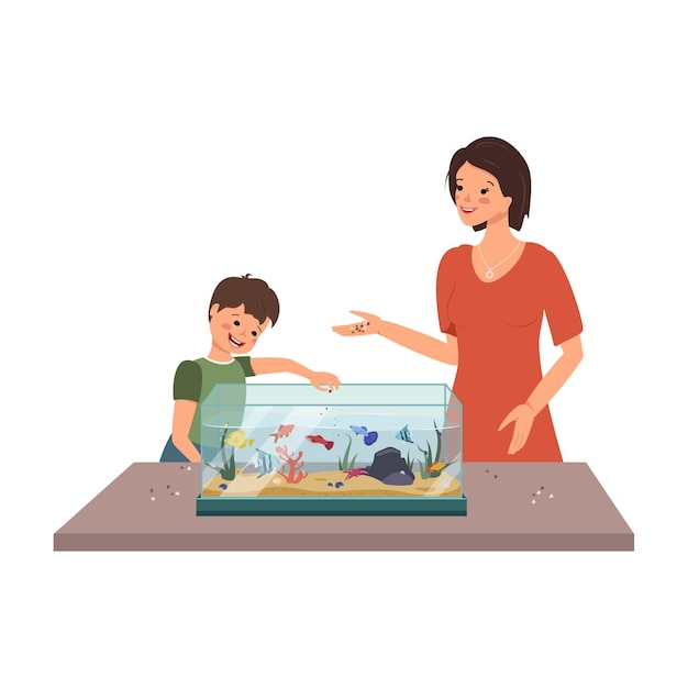 Mom and boy feed the fish in the aquarium