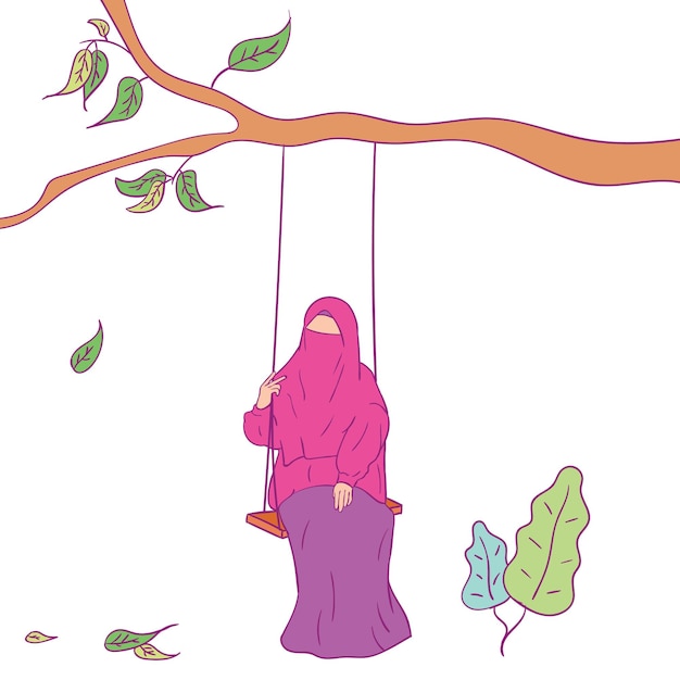 Muslim girl playing on a swing