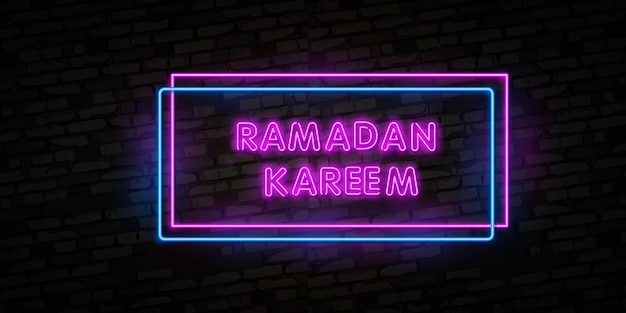 Neon sign Ramadan Kareem with lettering . Arabic inscription means ''Ramadan Kareem''.