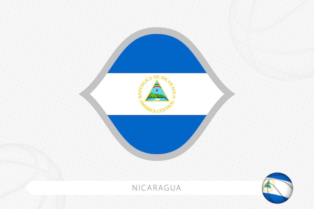 Nicaragua flag for basketball competition on gray basketball background.