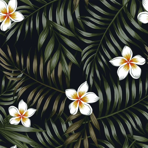 Night background of tropical leaves and flowers