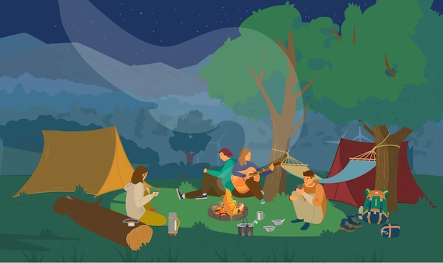 Night campsite with group of friends sitting around campfire and playing the guitar.