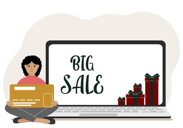 Online shopping Big sale A woman sits crosslegged in his hands holding a shopping card Next to a laptop with gifts