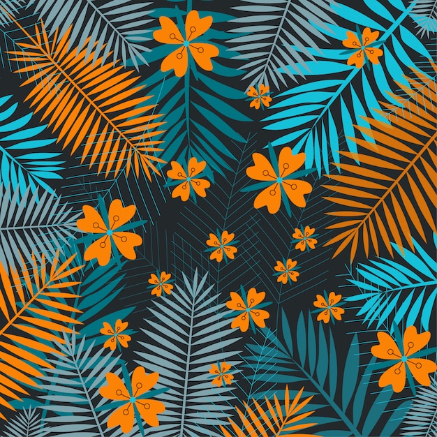 Orange and green tropical leaves on a dark background