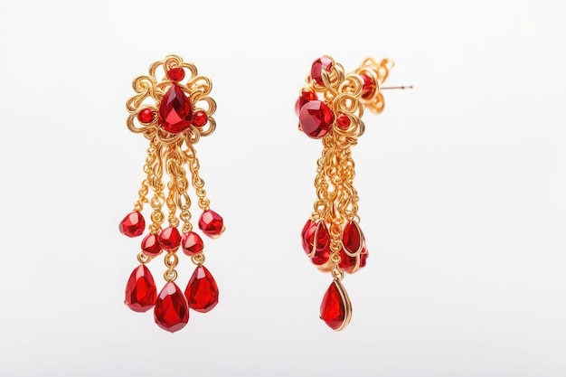 a pair of earrings with a red heart shaped drop earrings