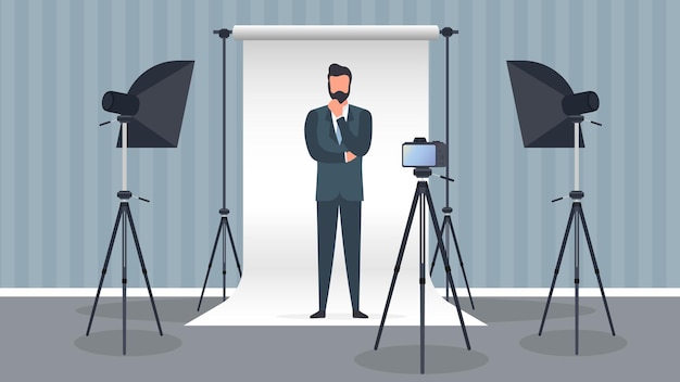 Photo Studio Vector. A man in a business suit poses for the camera. White canvas background on tripods. Camera on a tripod, softbox. Professional photo studio.