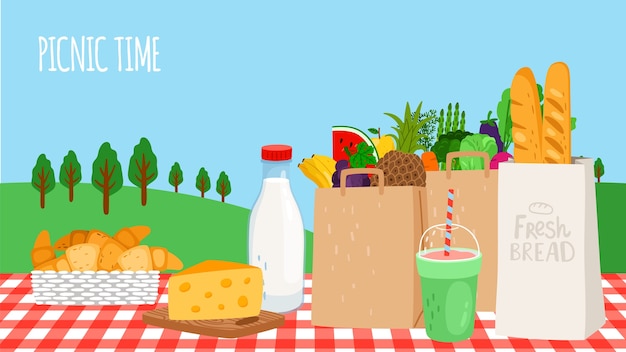 Picnic time. Fresh food, vegetables and fruits, shake and bread on table.