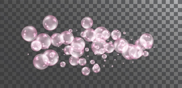 Pink transparent flying soap bubbles on dark transparent background